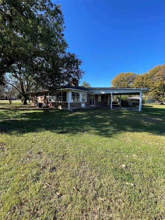 202 Spur Ranch Road Trinidad, TX 75163 - Photo 20 of 20 a view of a house with a yard