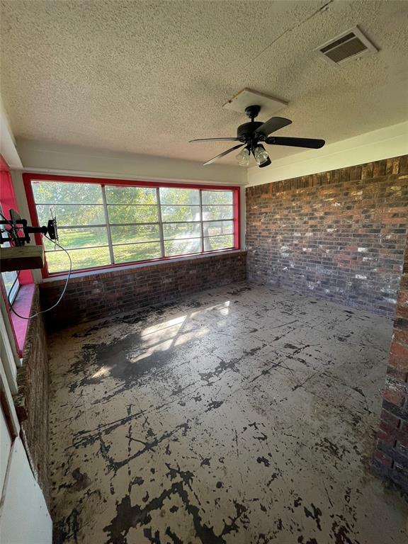 202 Spur Ranch Road Trinidad, TX 75163 - Photo 9 of 20 a view of a livingroom with a ceiling fan and window