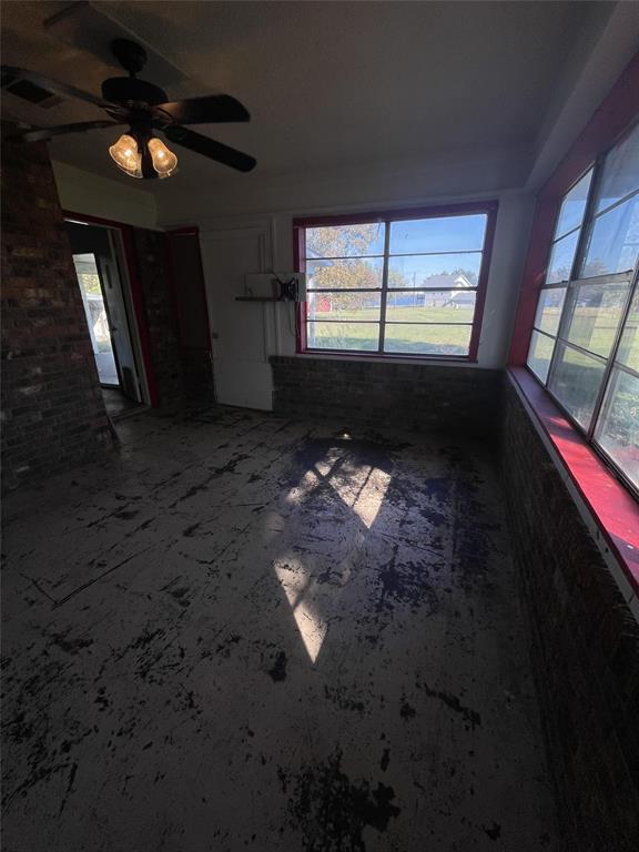202 Spur Ranch Road Trinidad, TX 75163 - Photo 10 of 20 a view of an empty room with wooden floor and a window