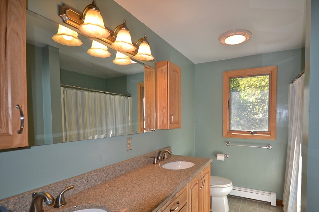 19 Bishop Road Rochester, MA 02770 - Photo 12 of 21 a bathroom with a sink a toilet and a mirror