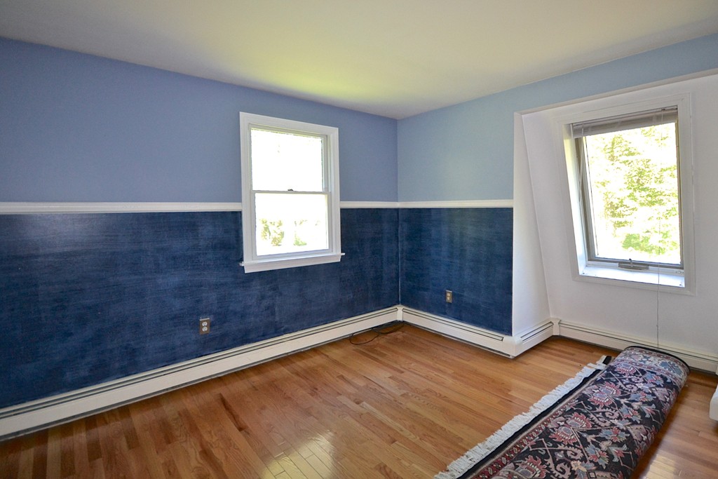 19 Bishop Road Rochester, MA 02770 - Photo 14 of 21 a view of an empty room with wooden floor and a window