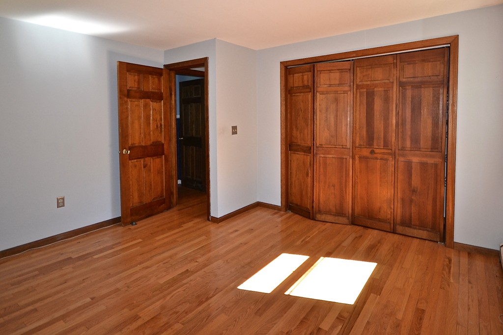 19 Bishop Road Rochester, MA 02770 - Photo 16 of 21 an empty room with wooden floor and closet
