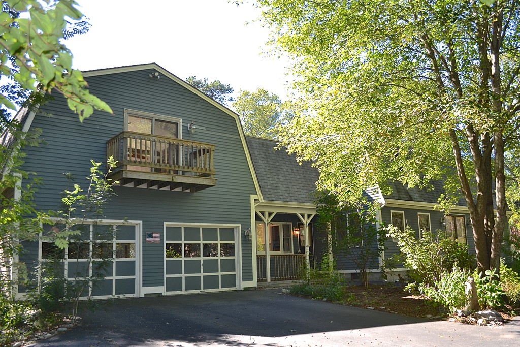 19 Bishop Road Rochester, MA 02770 - Photo 19 of 21 a front view of a house with a garden