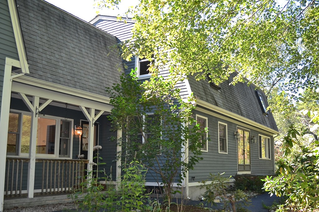 19 Bishop Road Rochester, MA 02770 - Photo 20 of 21 a front view of a house with a garden