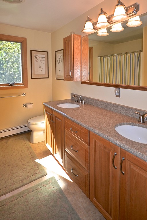 19 Bishop Road Rochester, MA 02770 - Photo 10 of 21 a bathroom with a granite countertop sink mirror vanity and toilet