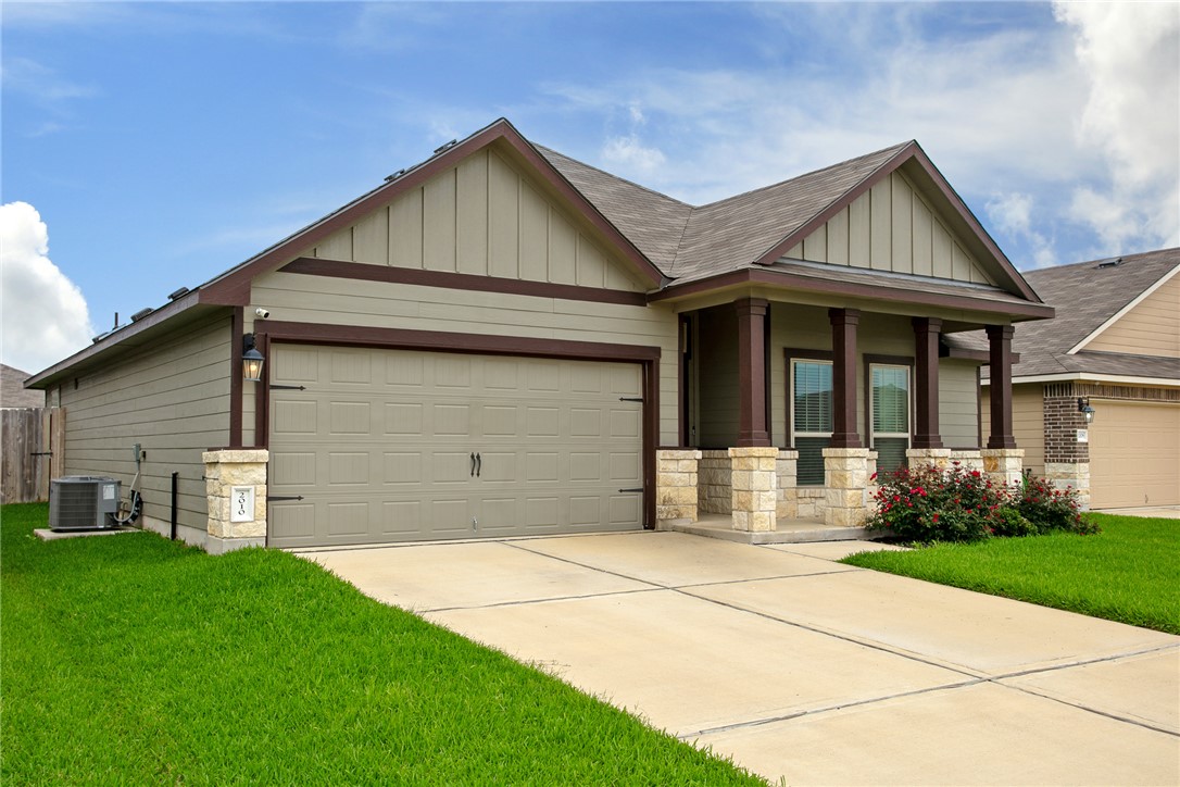 2010 Chief Street Bryan, TX 77807 - Photo 3 of 29 a front view of a house with a yard and garage