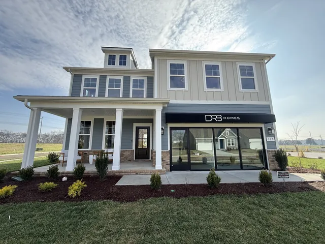 a view of an house with backyard porch and sitting area