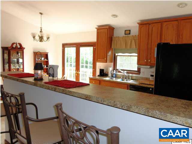 3804 Roundabout Road Louisa, VA 23093 - Photo 3 of 21 a large kitchen with a large window and stainless steel appliances