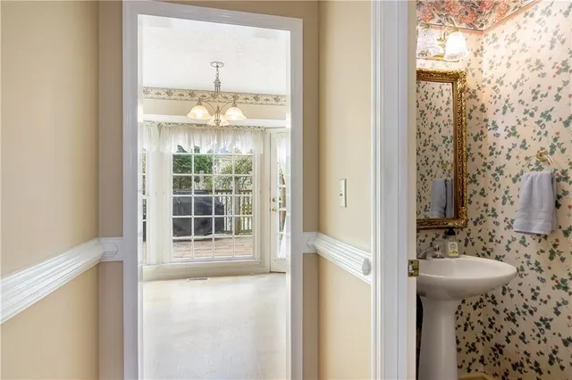 a bathroom with a sink and mirror
