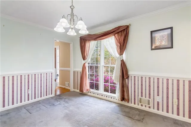 a view of an empty room with stairs