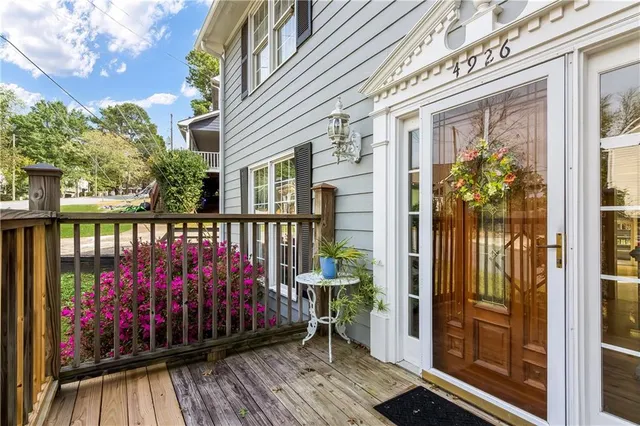 a view of a porch with wooden floor