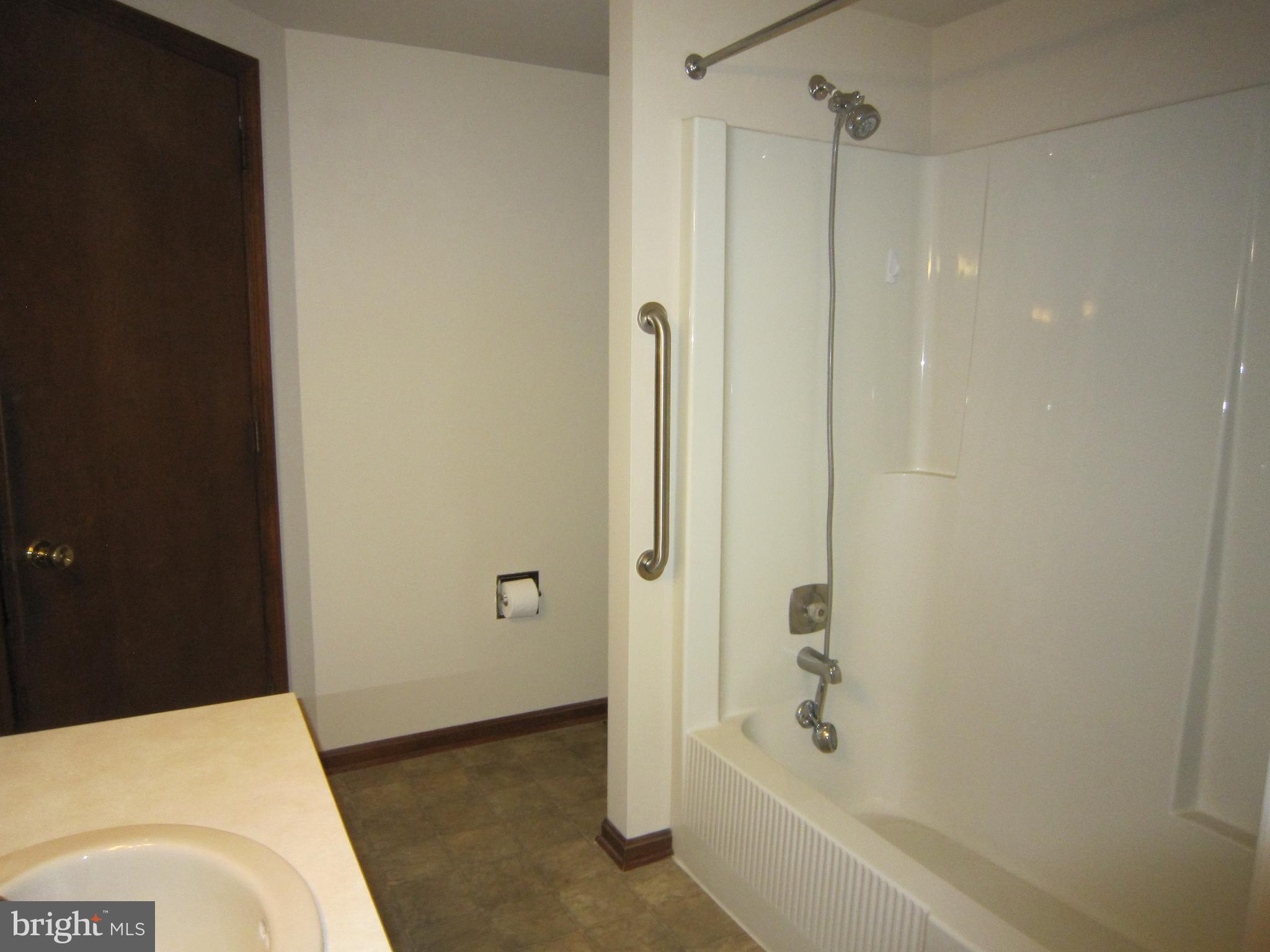 304 North Hoover Avenue, Unit B New Holland, PA 17557 - Photo 11 of 17 a bathroom with a bathtub and a shower
