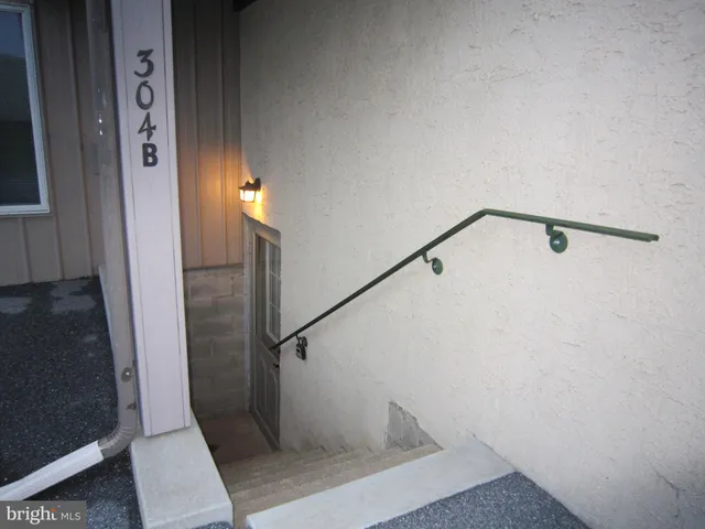 a view of a car parked in front of a house