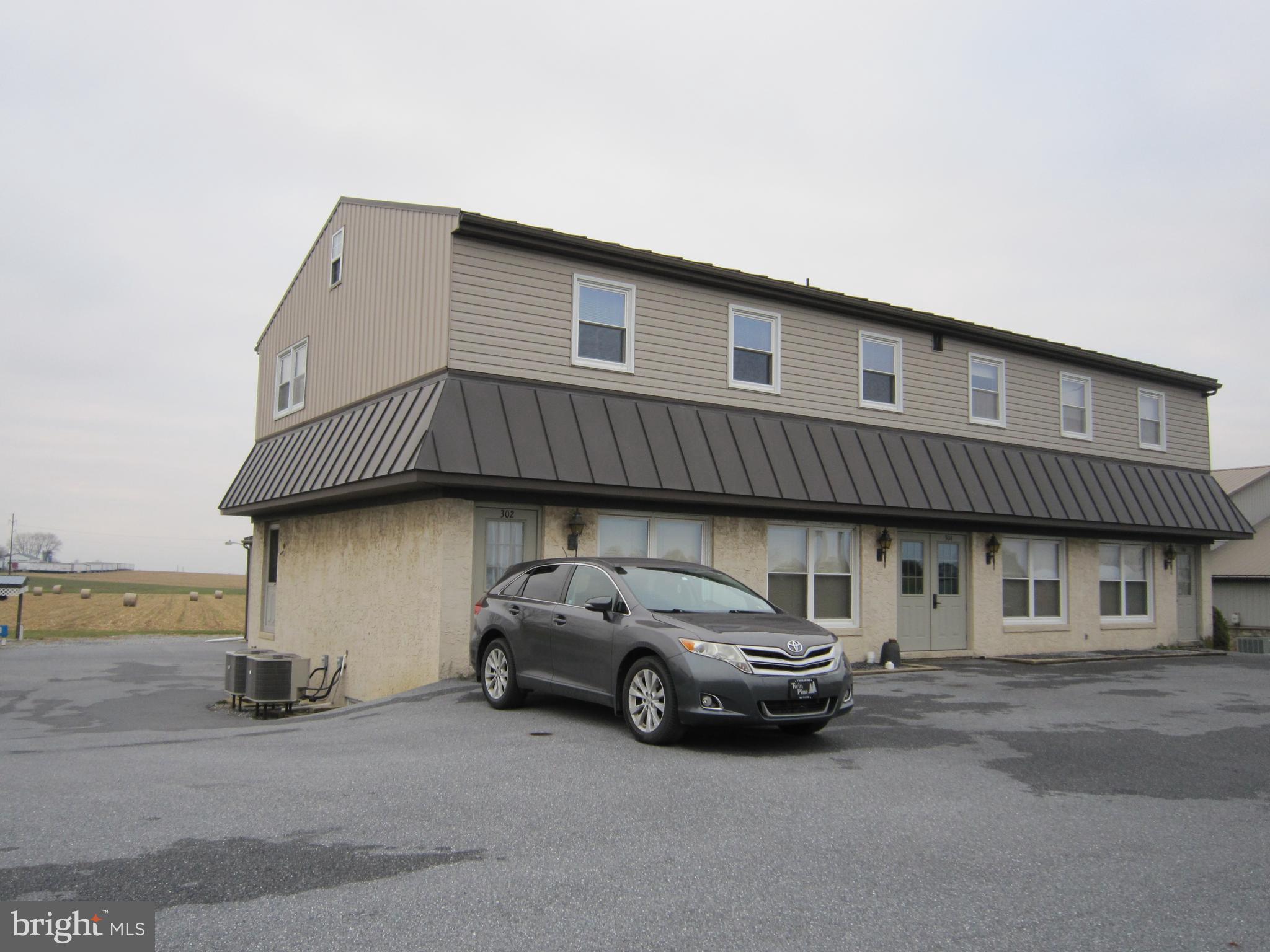 304 North Hoover Avenue, Unit B New Holland, PA 17557 - Photo 16 of 17 a view of a car parked in front of a house