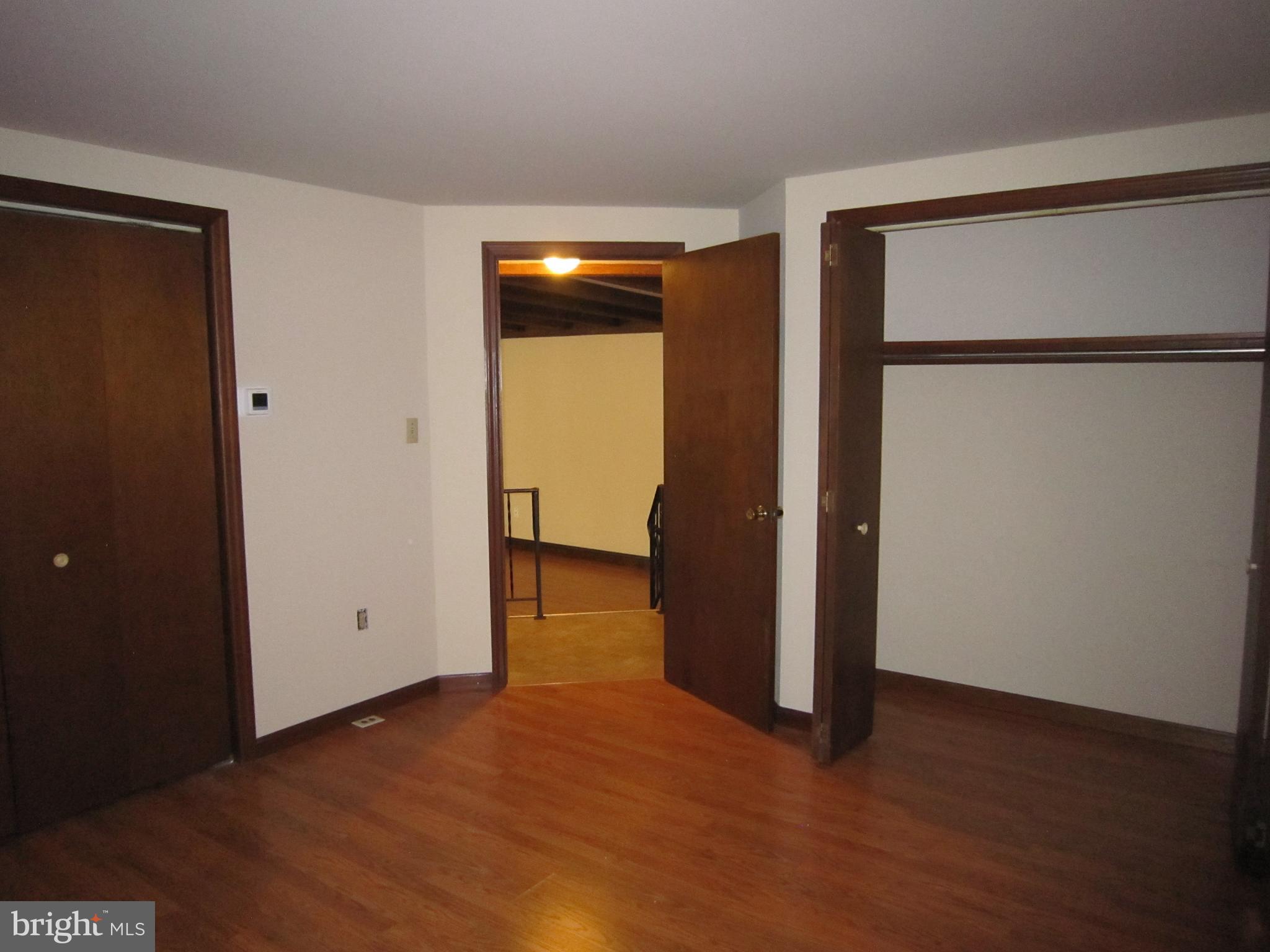 304 North Hoover Avenue, Unit B New Holland, PA 17557 - Photo 8 of 17 an empty room with closet and a bathroom