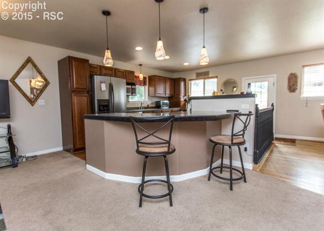 2007 North Chelton Road Colorado Springs, CO 80909 - Photo 7 of 35 Here is another view of the bar in the kitchen area.