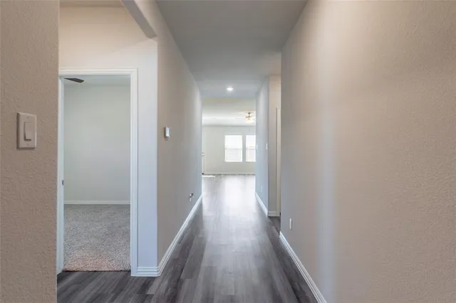 a view of a livingroom with furniture and a window