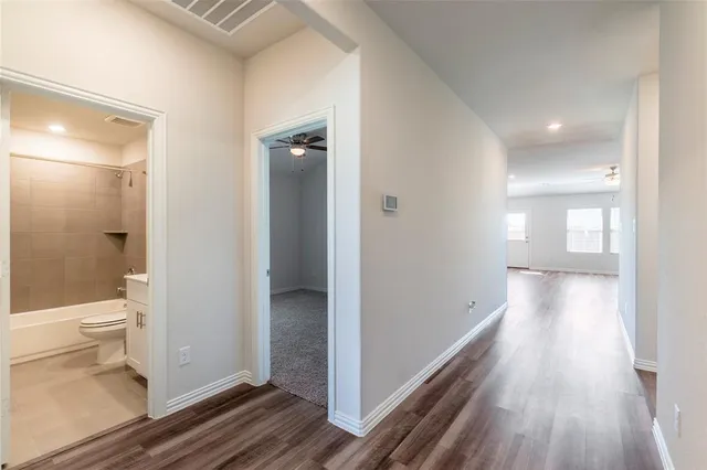 a bedroom with bed and window with window