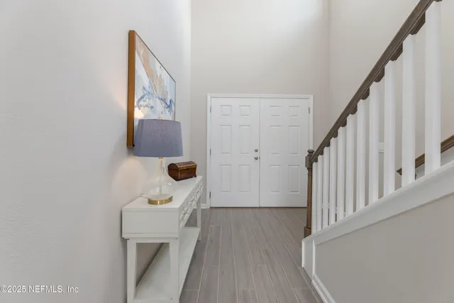 a view of a hallway with staircase