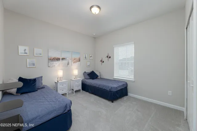 a bedroom with a bed and a chair