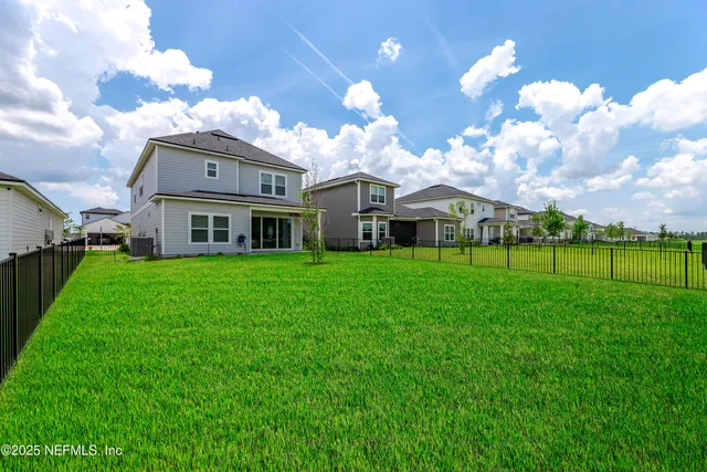 a view of a house with a big yard