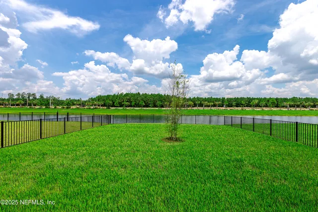 a view of a golf course with a lake