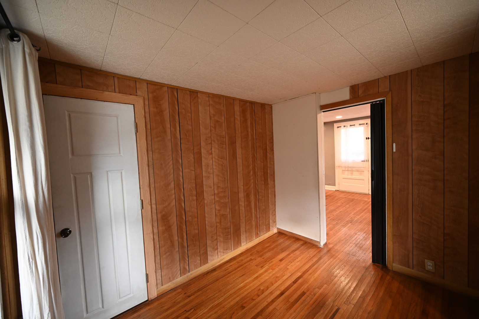 219 South 7th Street DeKalb, IL 60115 - Photo 14 of 30 an empty room with wooden floor and a window