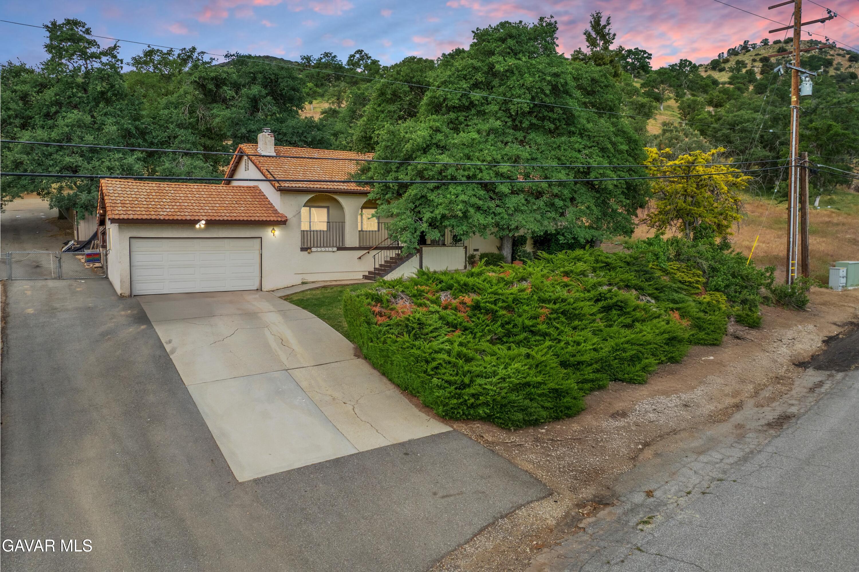 22217 Valley Vista Drive Tehachapi, CA 93561 - Photo 17 of 17 a front view of a house with a yard and trees