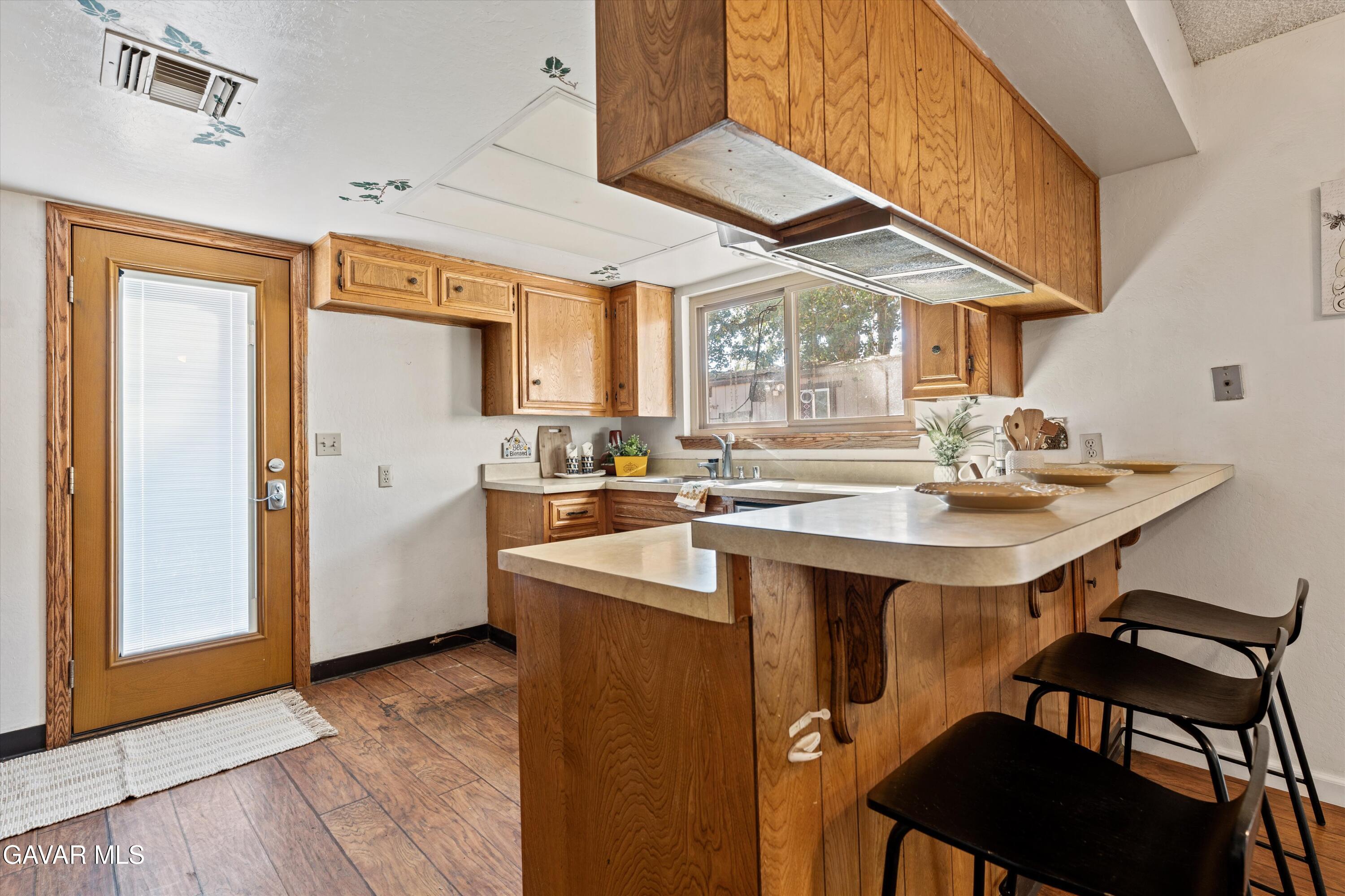 22217 Valley Vista Drive Tehachapi, CA 93561 - Photo 3 of 17 a kitchen with stainless steel appliances granite countertop a sink and a refrigerator
