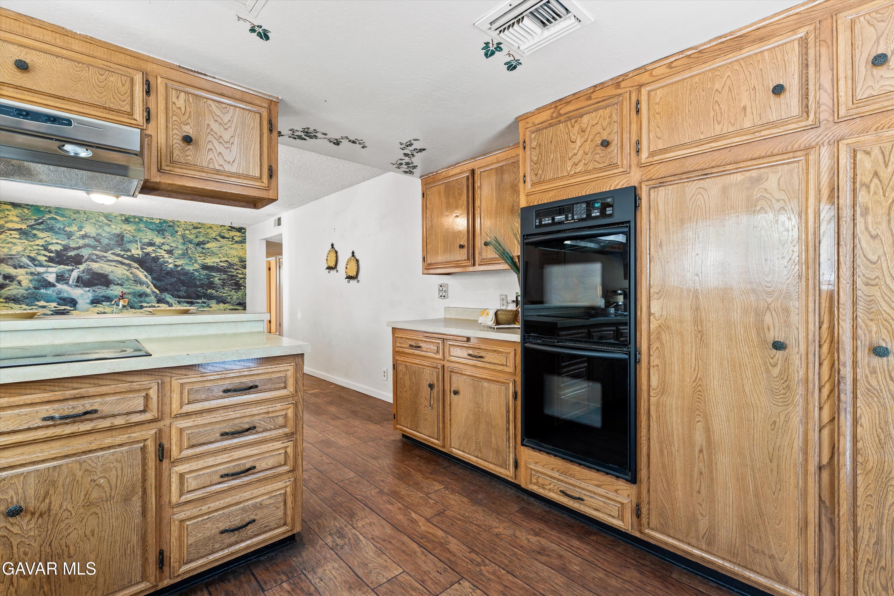 22217 Valley Vista Drive Tehachapi, CA 93561 - Photo 4 of 17 a kitchen with stainless steel appliances granite countertop a stove and a refrigerator