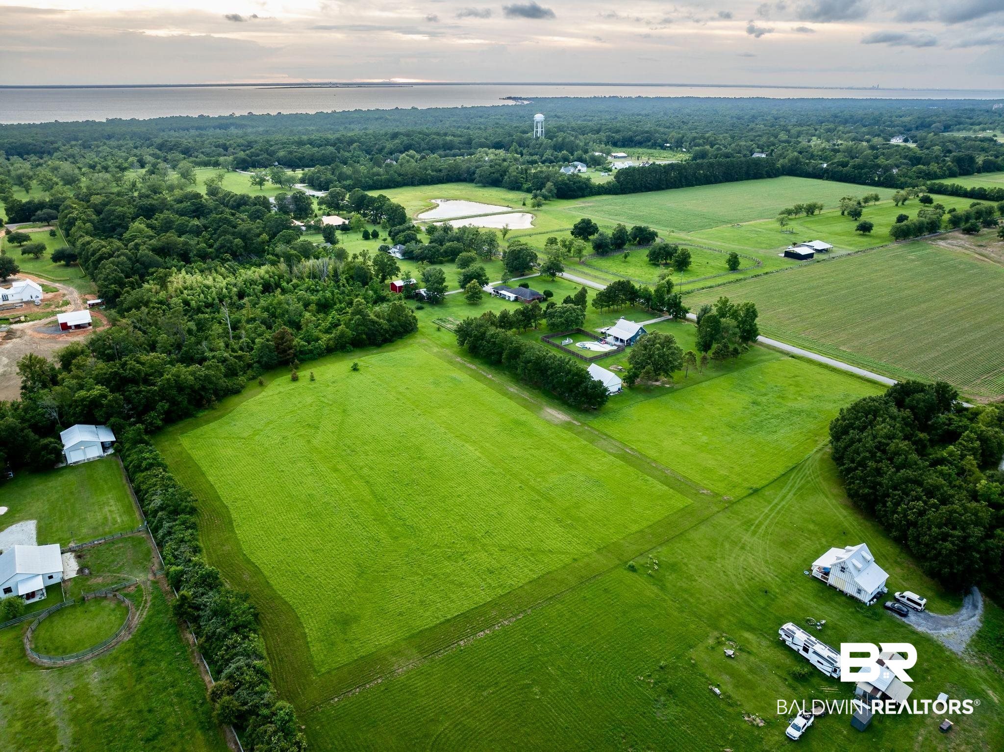 Birds eye view of property featuring a rural view and a water view