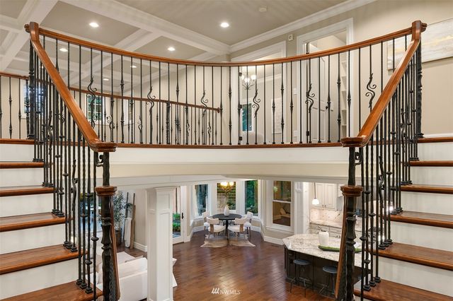 a bathroom with a granite countertop toilet a sink and a bathtub