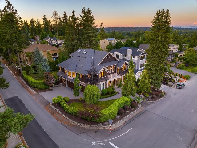 a aerial view of a house with a garden and trees