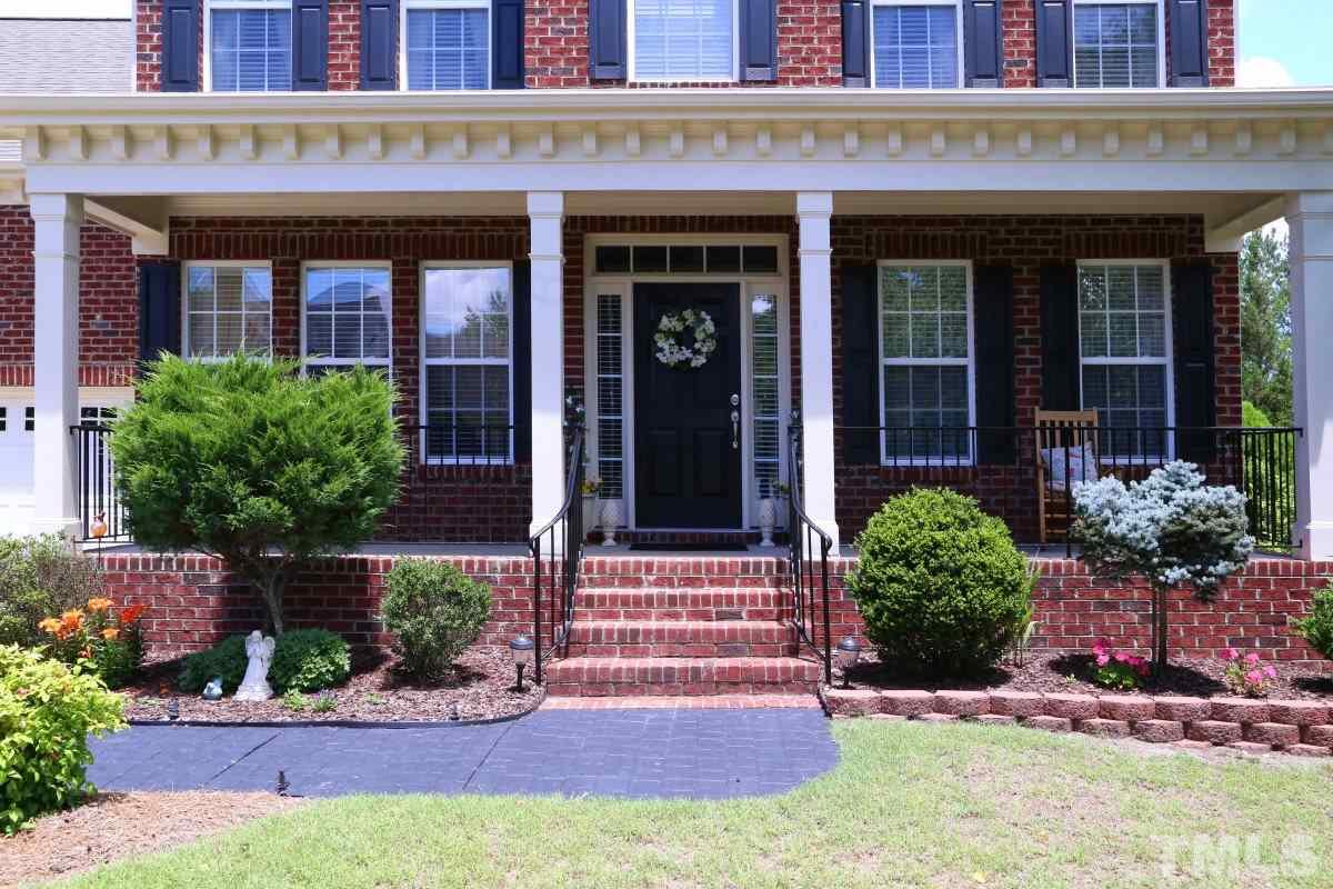 1012 Newburgh Circle Raleigh, NC 27603 - Photo 2 of 25 front view of a brick house with a yard