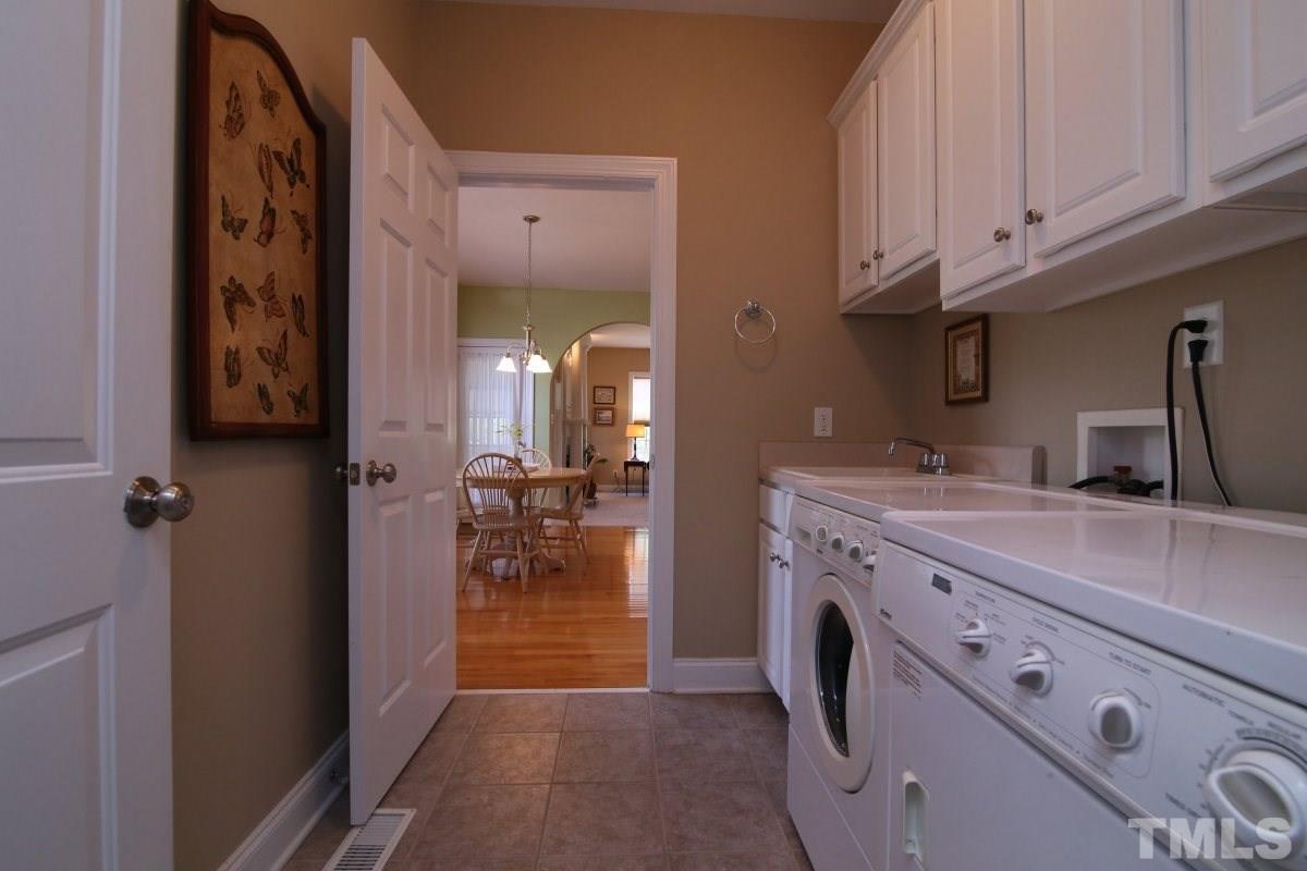 1012 Newburgh Circle Raleigh, NC 27603 - Photo 11 of 25 a view of hallway with washer and dryer