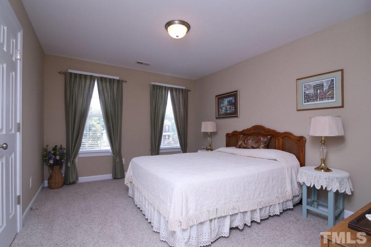 1012 Newburgh Circle Raleigh, NC 27603 - Photo 15 of 25 a spacious bedroom with a bed and a window