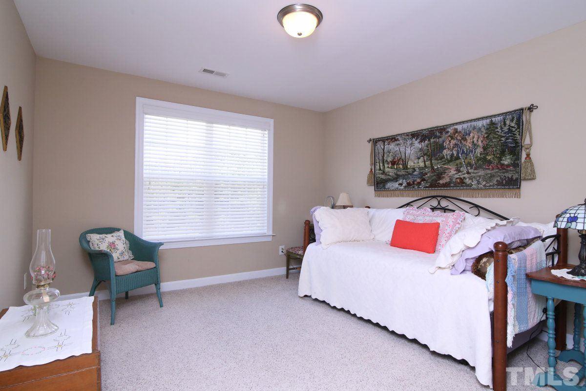 1012 Newburgh Circle Raleigh, NC 27603 - Photo 16 of 25 a living room with furniture and a window