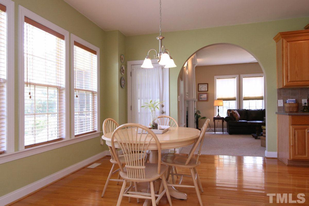 1012 Newburgh Circle Raleigh, NC 27603 - Photo 10 of 25 a dining room with furniture window and wooden floor