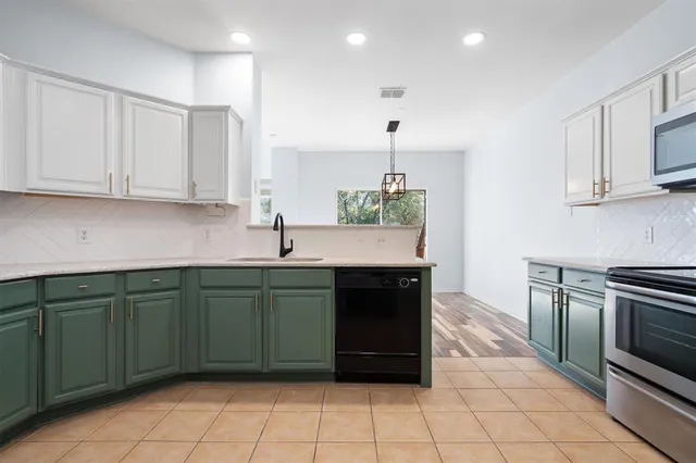 a kitchen with a sink and cabinets