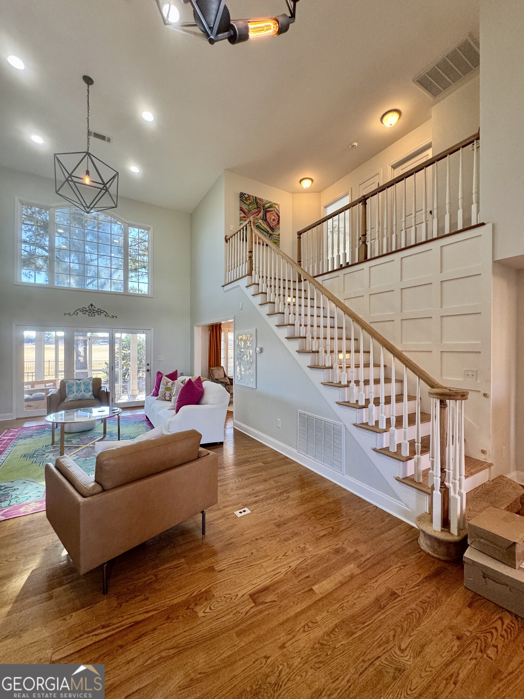 49 Aberdeen Circle Cordele, GA 31015 - Photo 14 of 63 a living room with furniture and a dining table with wooden floor