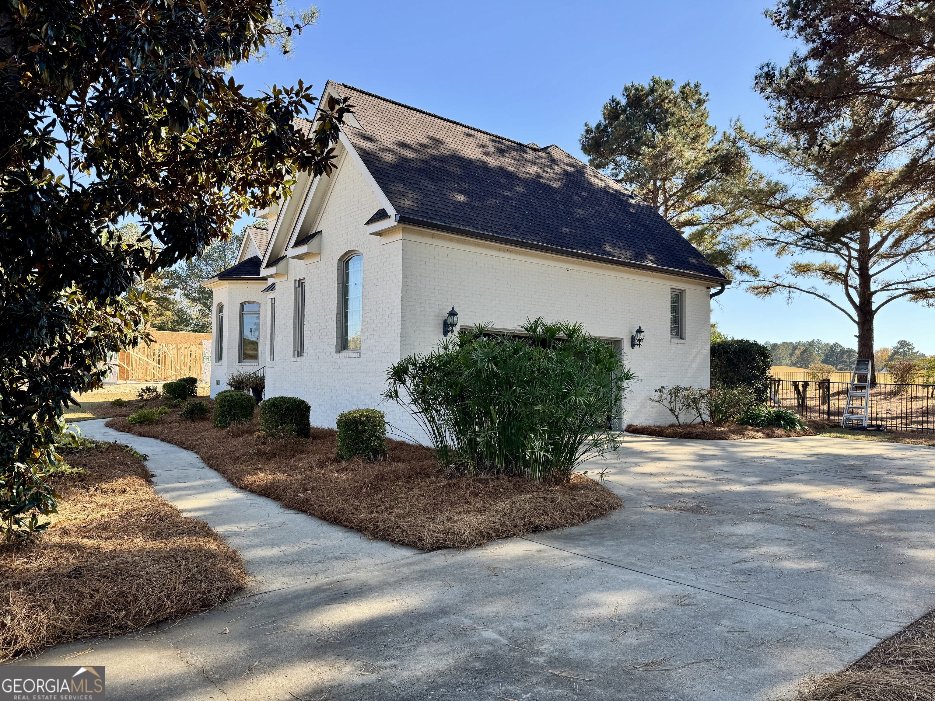 49 Aberdeen Circle Cordele, GA 31015 - Photo 3 of 63 a view of a house with a yard and garage