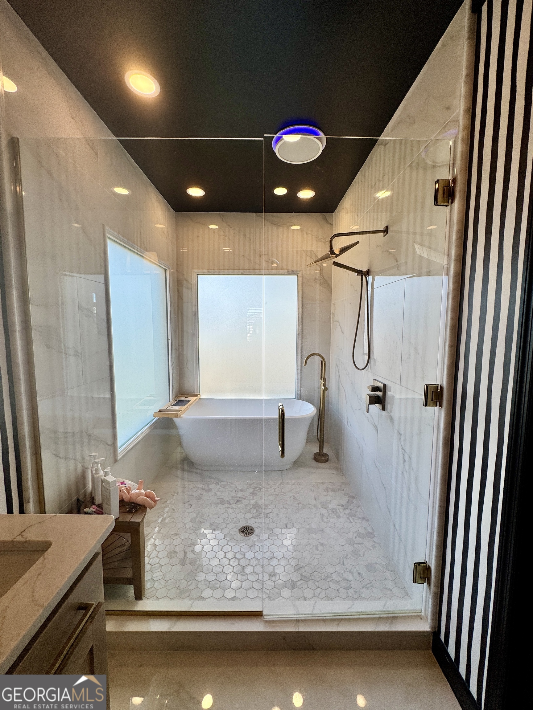 49 Aberdeen Circle Cordele, GA 31015 - Photo 31 of 63 a bathroom with a granite countertop sink a mirror and shower