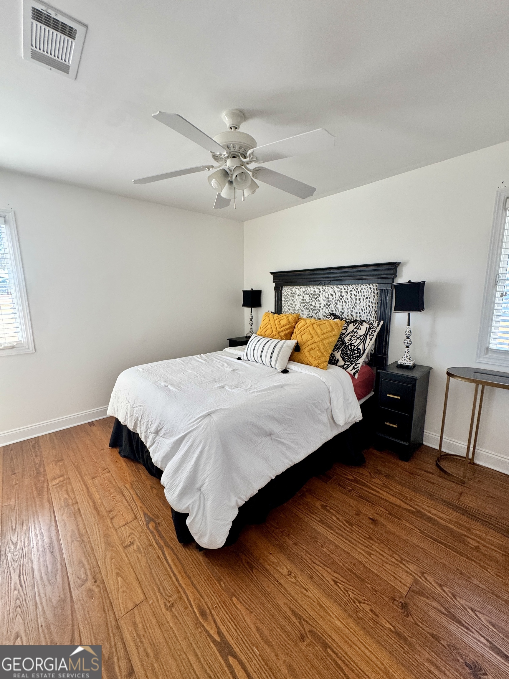 49 Aberdeen Circle Cordele, GA 31015 - Photo 38 of 63 a bedroom with a bed and wooden floor