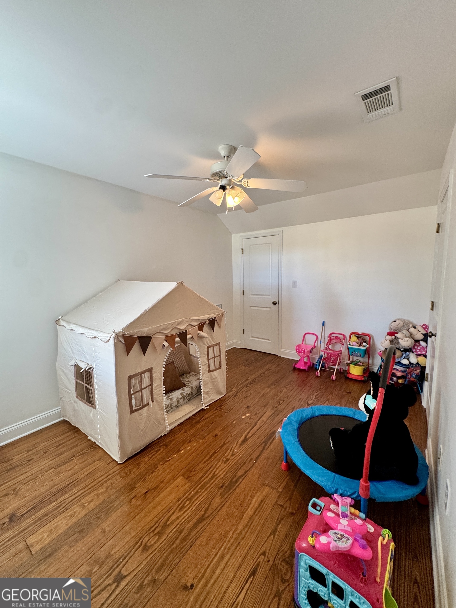 49 Aberdeen Circle Cordele, GA 31015 - Photo 42 of 63 a living room with furniture and a wooden floor