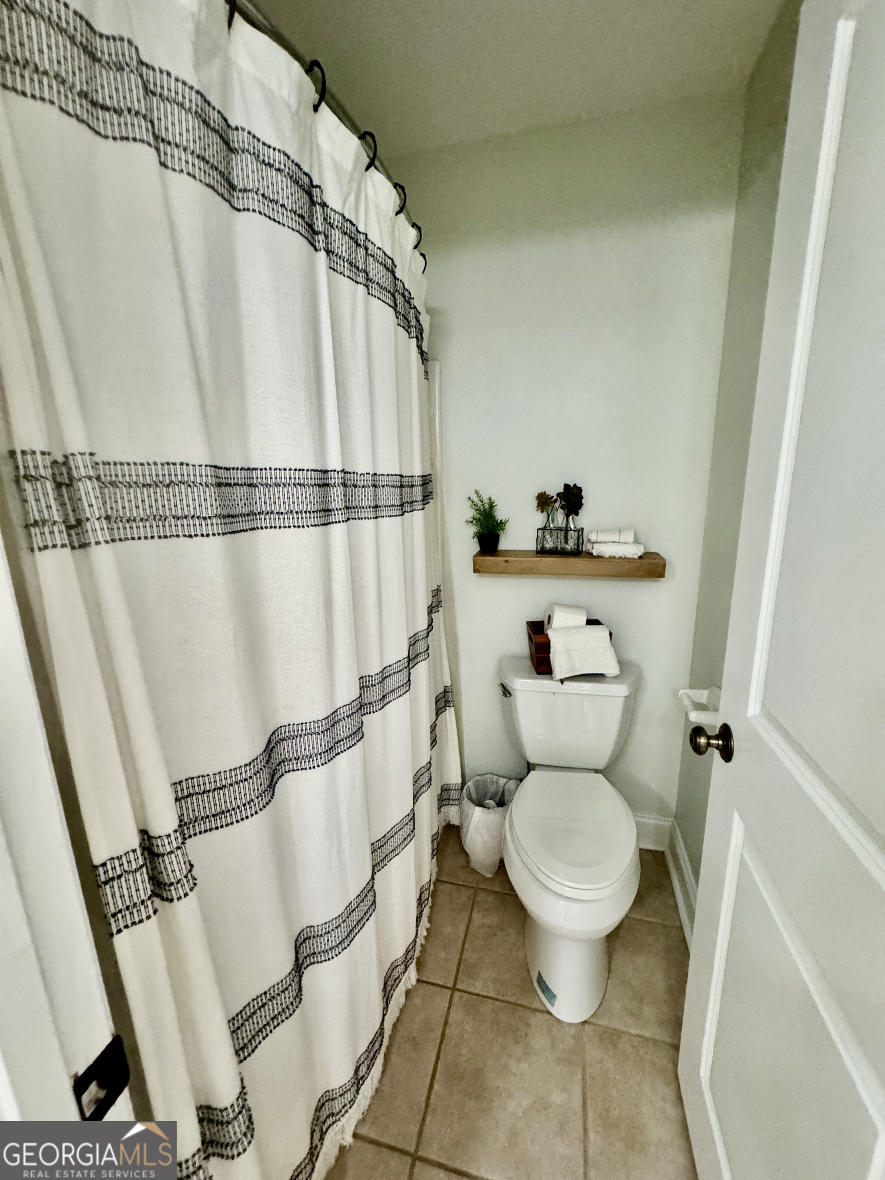 49 Aberdeen Circle Cordele, GA 31015 - Photo 44 of 63 a bathroom with a toilet and a shower