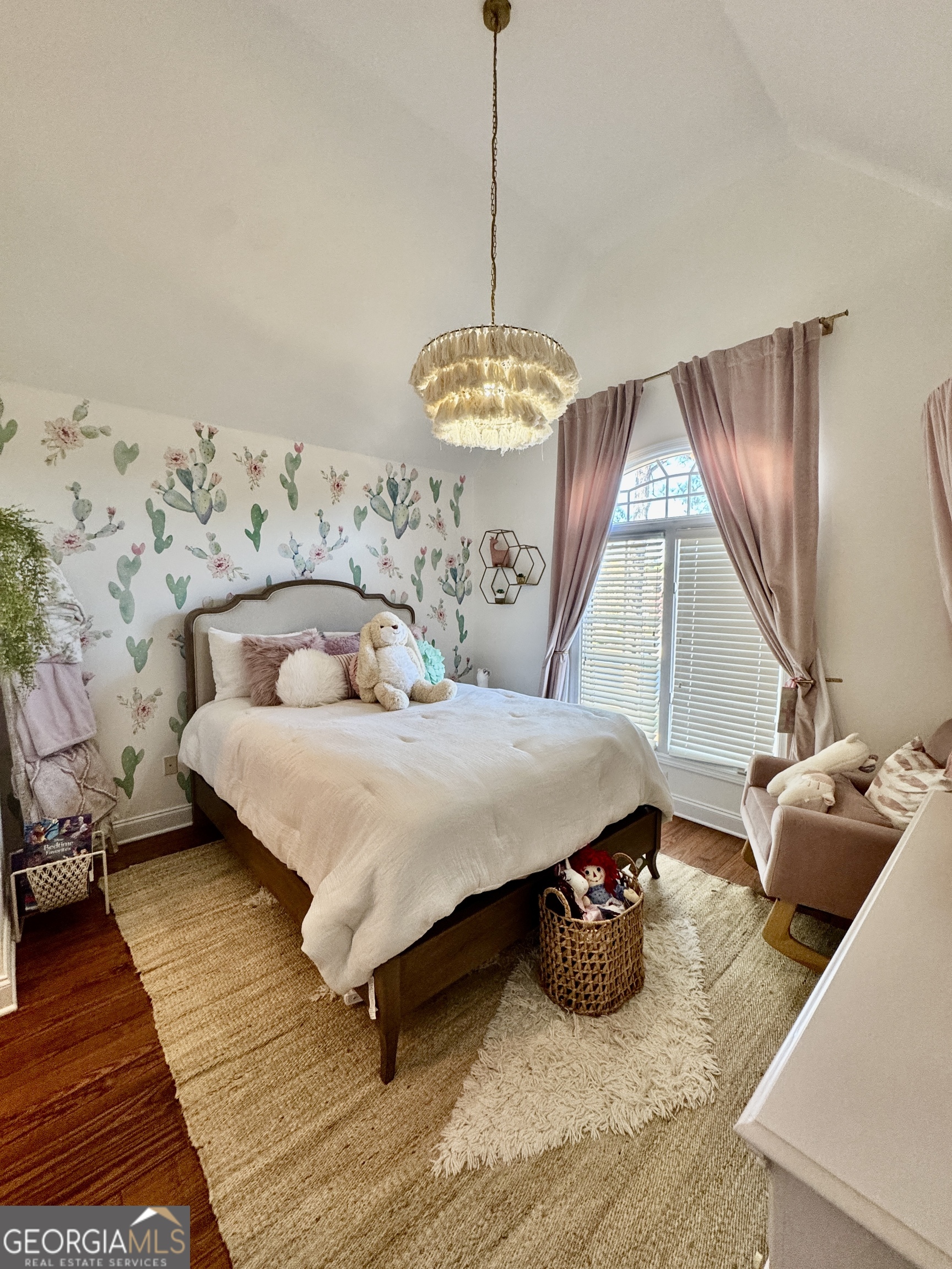 49 Aberdeen Circle Cordele, GA 31015 - Photo 46 of 63 a bedroom with a bed and a chandelier