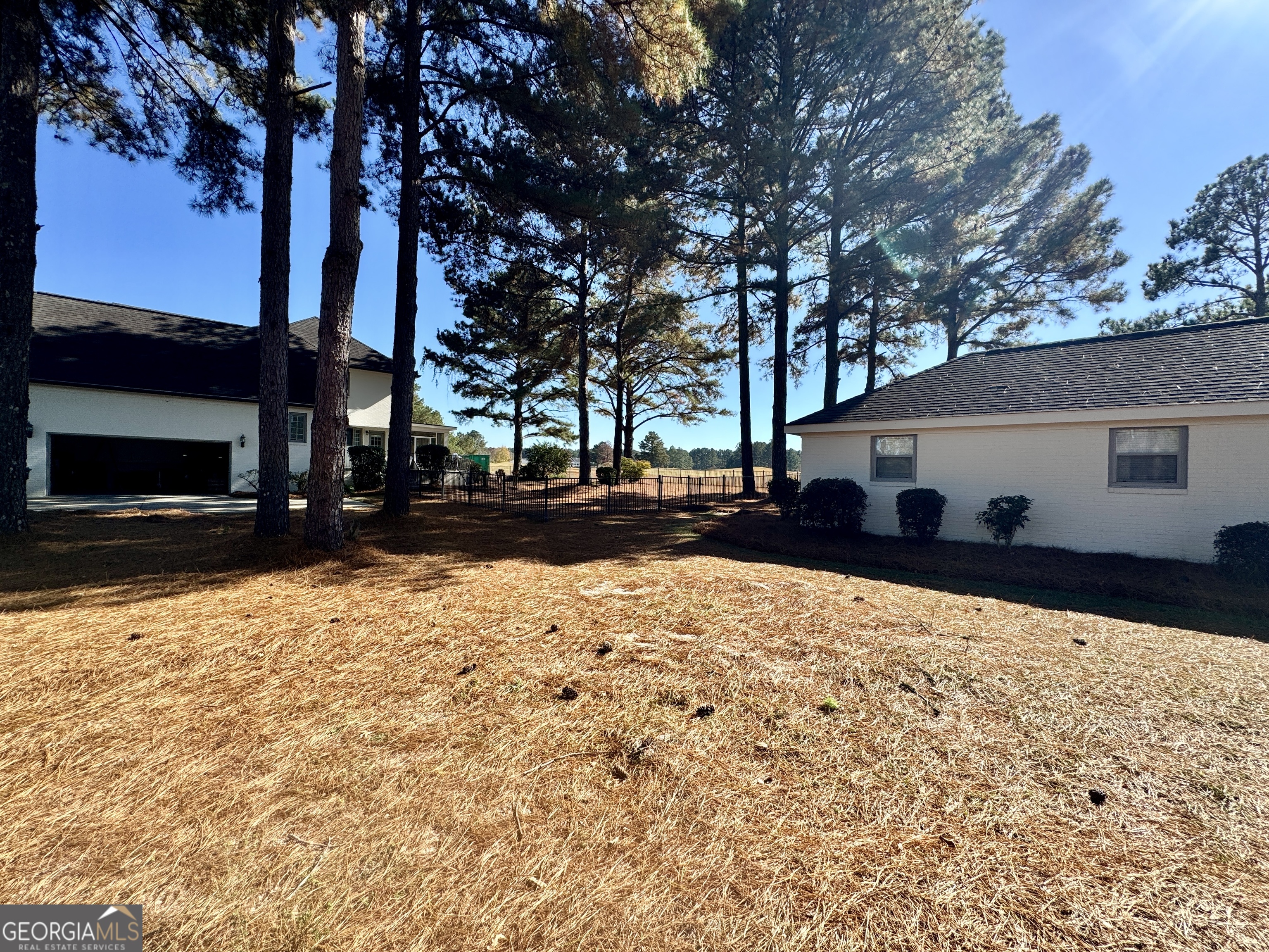 49 Aberdeen Circle Cordele, GA 31015 - Photo 5 of 63 a front view of a house with a yard covered in snow