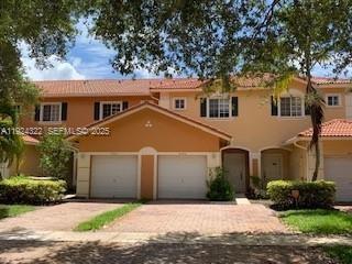 6533 Catalina Lane, Unit 6533 Tamarac, FL 33321 - Photo 1 of 27 front view of a house with a yard