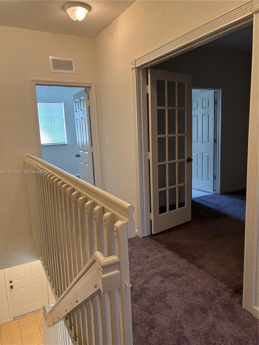 6533 Catalina Lane, Unit 6533 Tamarac, FL 33321 - Photo 12 of 27 a view of an empty room with wooden floor