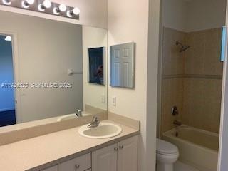 6533 Catalina Lane, Unit 6533 Tamarac, FL 33321 - Photo 16 of 27 a bathroom with a sink a toilet and shower